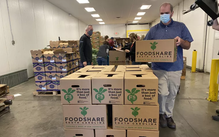 Masked man with boxes