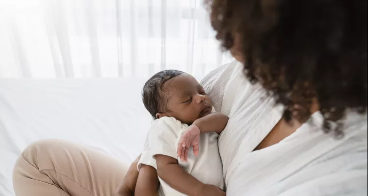 A mother holds her baby