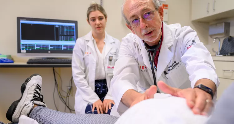 doctor and assistant treat patient