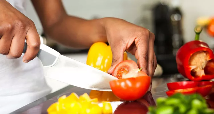 Hand chopping vegetables