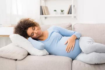 Pregnant woman on sofa