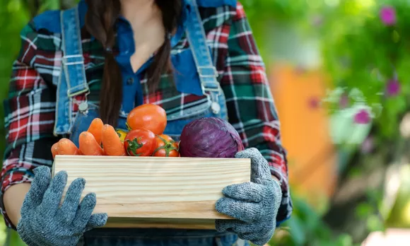 Woman carrying veggie basket